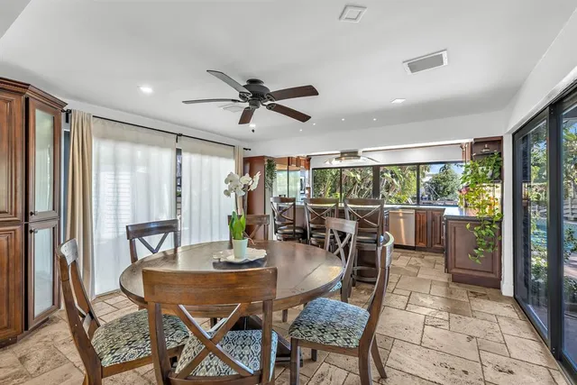 a living room with furniture a rug and a chandelier