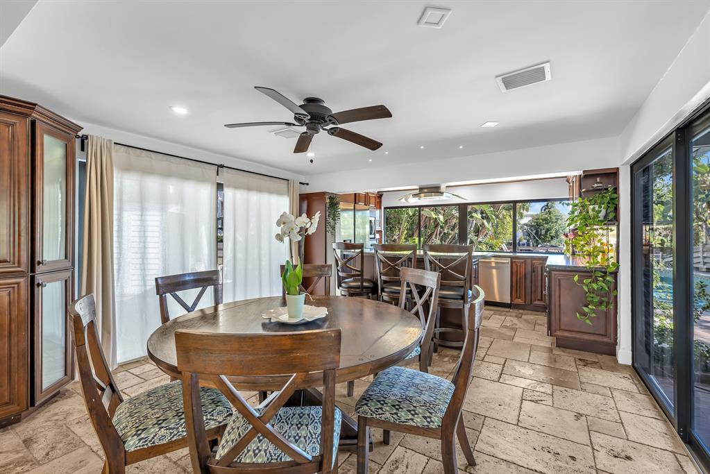 2801 Northeast 48th Court Lighthouse Point, FL 33064 - Photo 13 of 50 a view of a dining room with furniture window and outside view