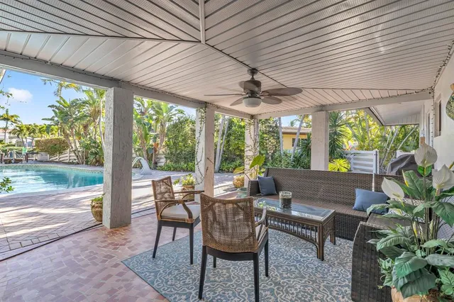 a house with palm tree in front of it