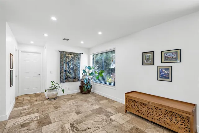 a view of a swimming pool with an outdoor space and seating area