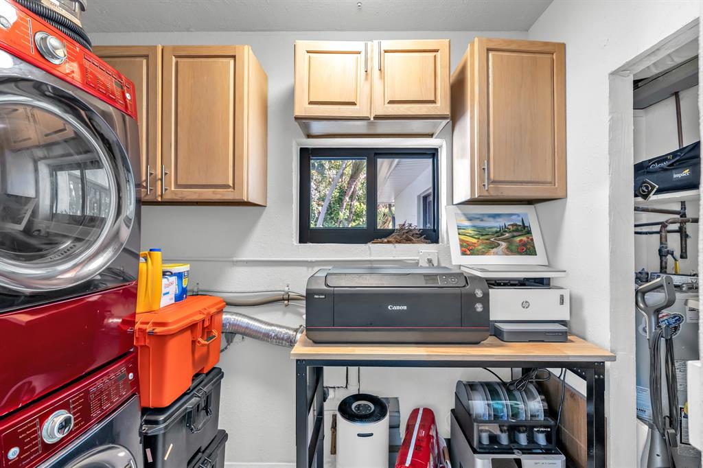2801 Northeast 48th Court Lighthouse Point, FL 33064 - Photo 35 of 50 a kitchen with stainless steel appliances granite countertop a refrigerator and a stove