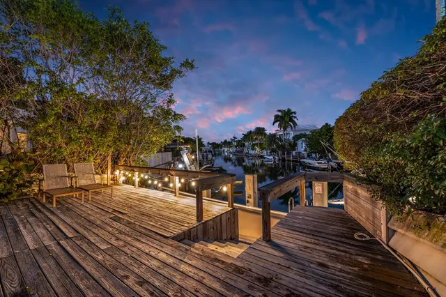 a big yard with table and trees