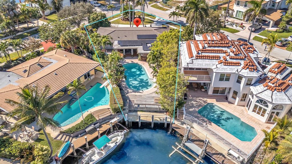 2801 Northeast 48th Court Lighthouse Point, FL 33064 - Photo 5 of 50 an aerial view of a house with a garden