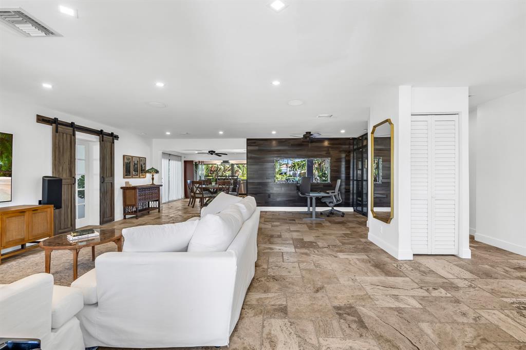 2801 Northeast 48th Court Lighthouse Point, FL 33064 - Photo 7 of 50 a living room with furniture and a large window