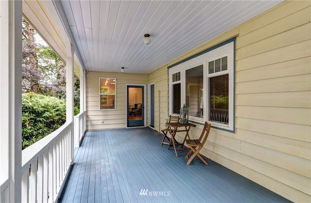 a view of a room with wooden floor and outdoor space