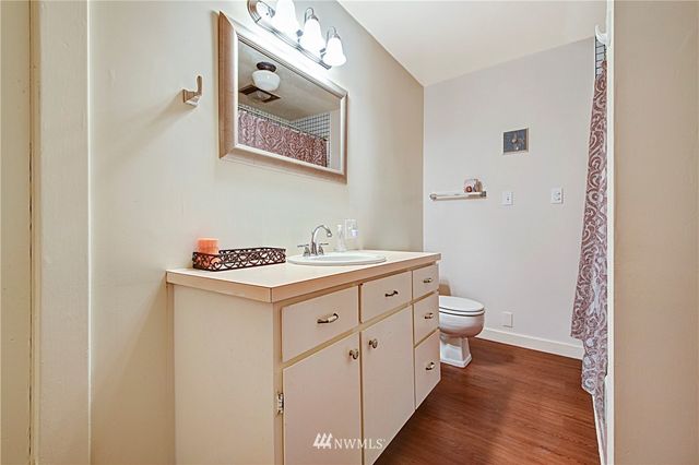 a utility room with cabinets washer and dryer