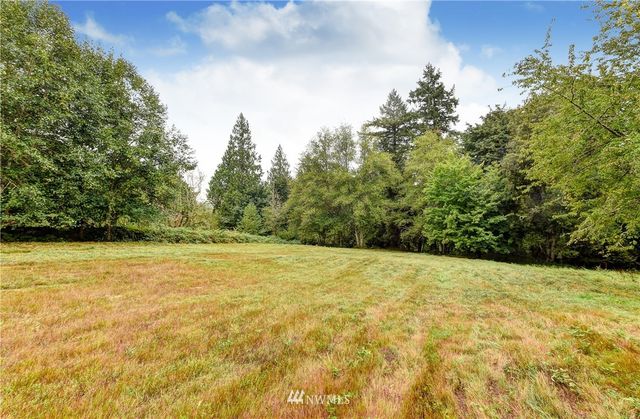 a view of big yard with an outdoor space