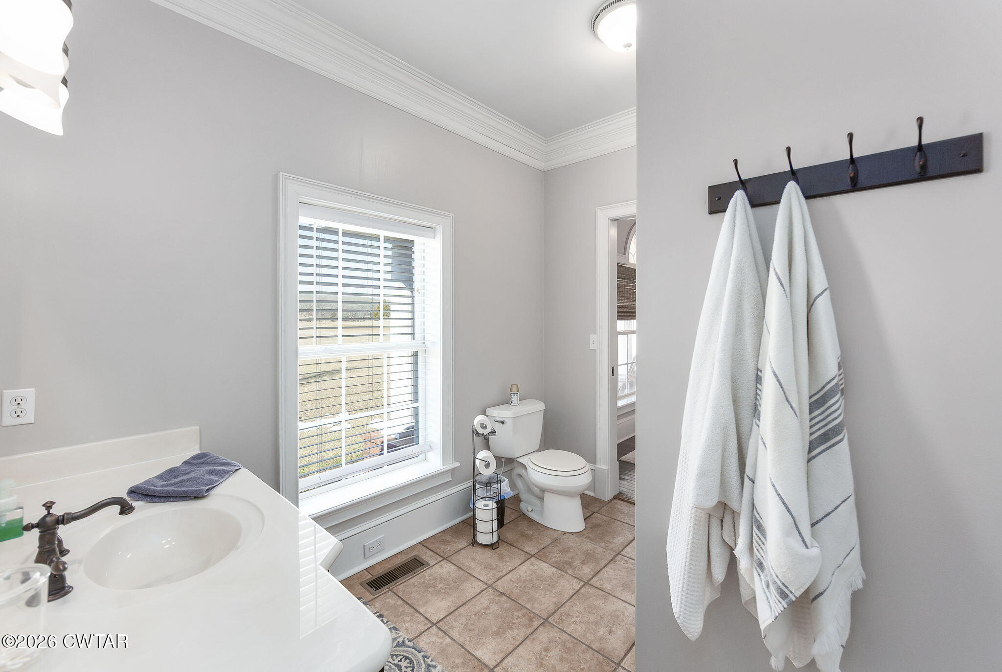 4320 Timberlake-Wildersville Road Lexington, TN 38351 - Photo 25 of 58 a bathroom with a sink toilet and tub