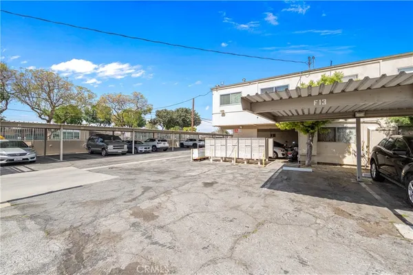 a view of a porch with furniture and a garage