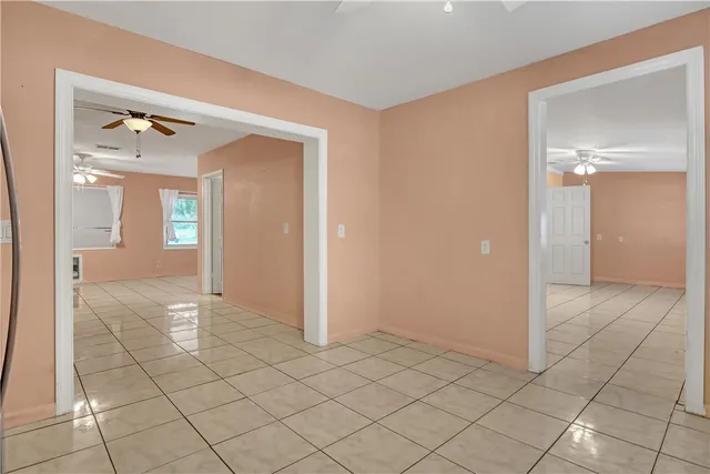 a view of a bathroom with a shower and a mirror