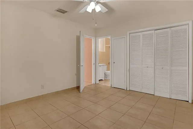 an empty room with fan