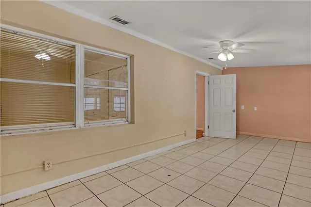 a view of an empty room with a window