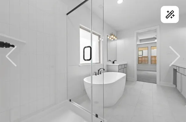 a spacious bathroom with a double vanity sink mirror and a bathtub