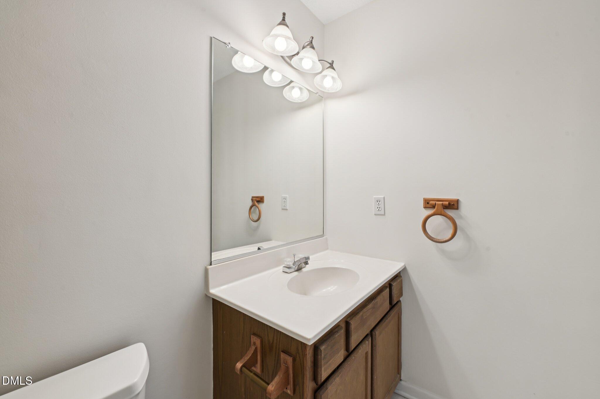 135 Long Shadow Place Durham, NC 27713 - Photo 17 of 23 a bathroom with a sink vanity and a mirror