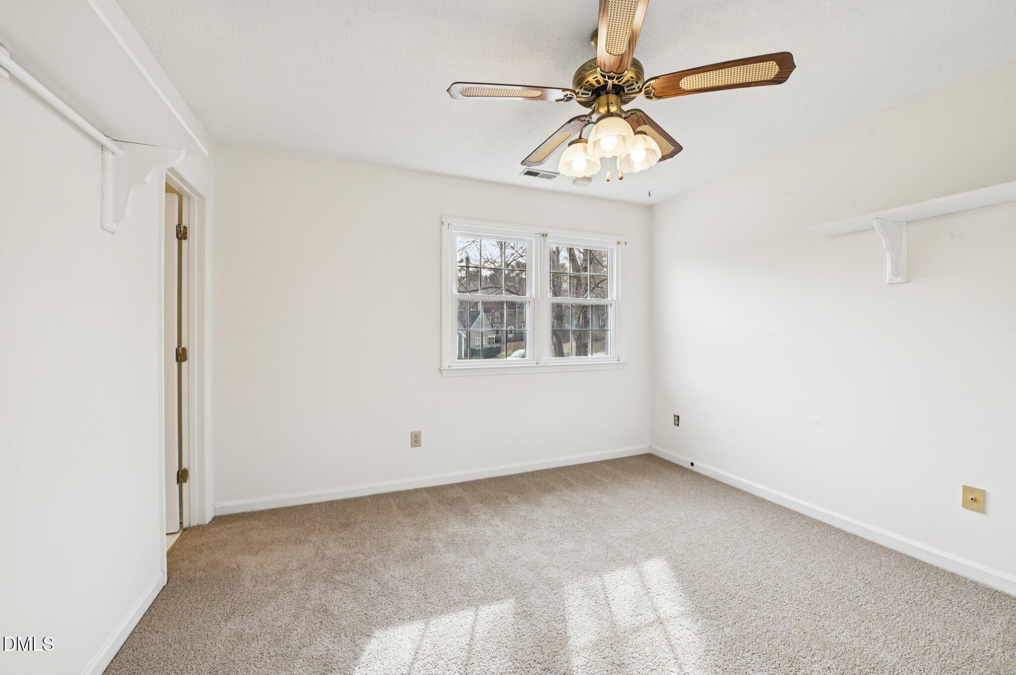 135 Long Shadow Place Durham, NC 27713 - Photo 18 of 23 an empty room with windows and fan