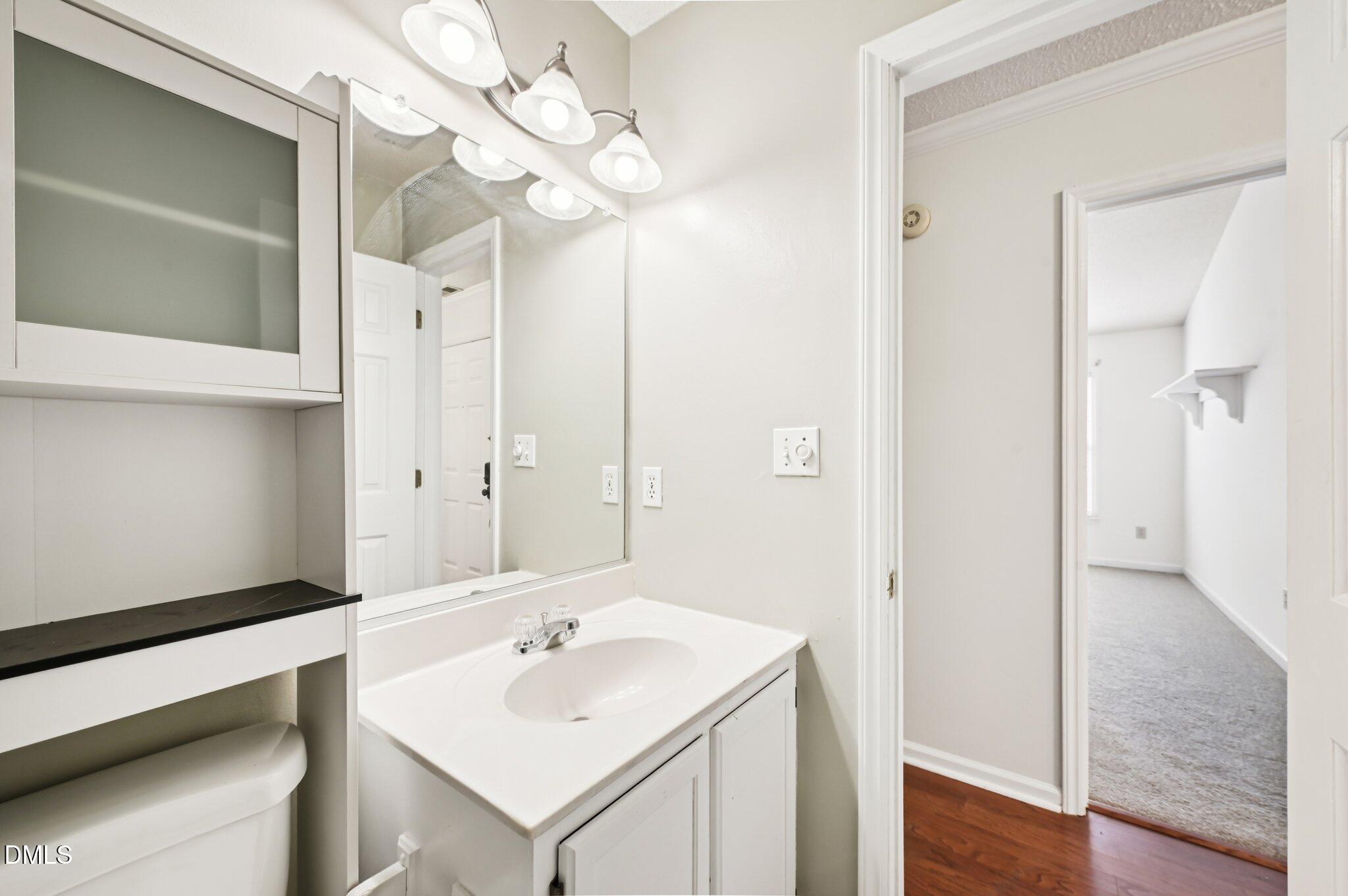 135 Long Shadow Place Durham, NC 27713 - Photo 20 of 23 a bathroom with a sink a mirror and a shower