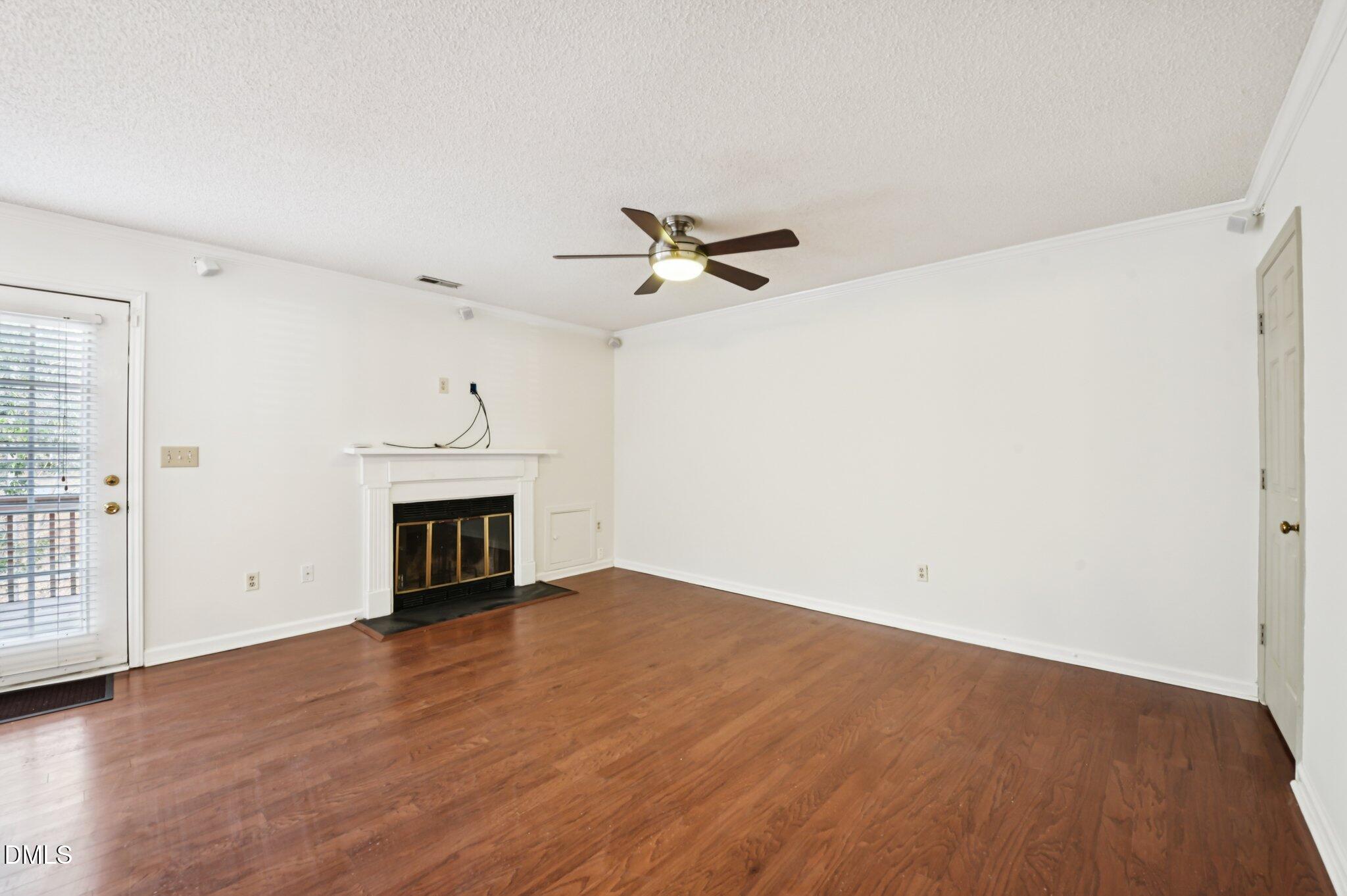 135 Long Shadow Place Durham, NC 27713 - Photo 5 of 23 wooden floor in an empty room with a fireplace
