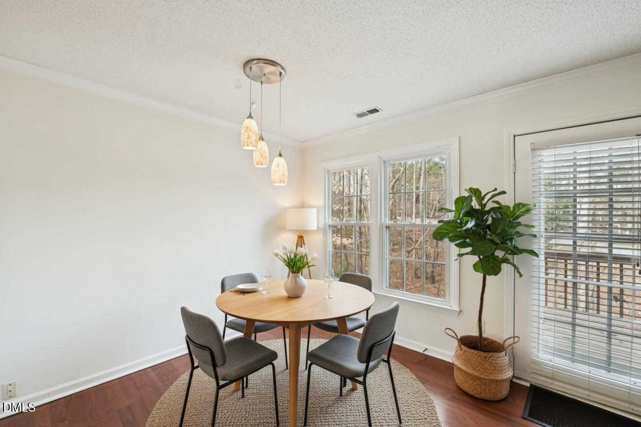 135 Long Shadow Place Durham, NC 27713 - Photo 7 of 23 a view of a dining room with furniture window and outside view