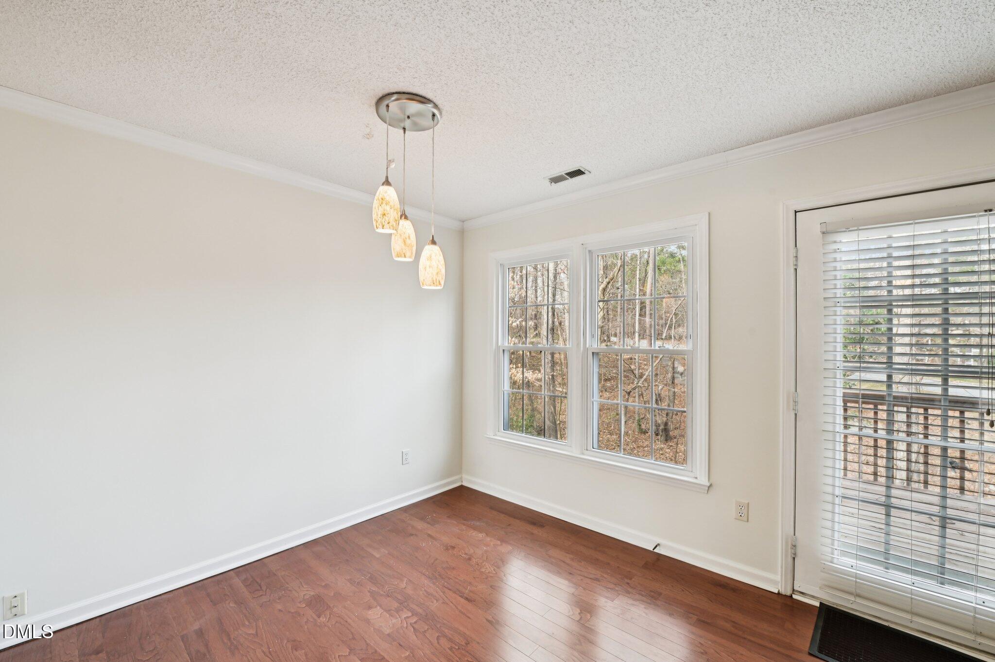 135 Long Shadow Place Durham, NC 27713 - Photo 8 of 23 a view of an empty room with a window