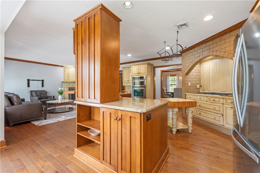 103 Golfview Drive Gibsonia, PA 15044 - Photo 12 of 33 a very nice looking living room with a large window and wooden floor