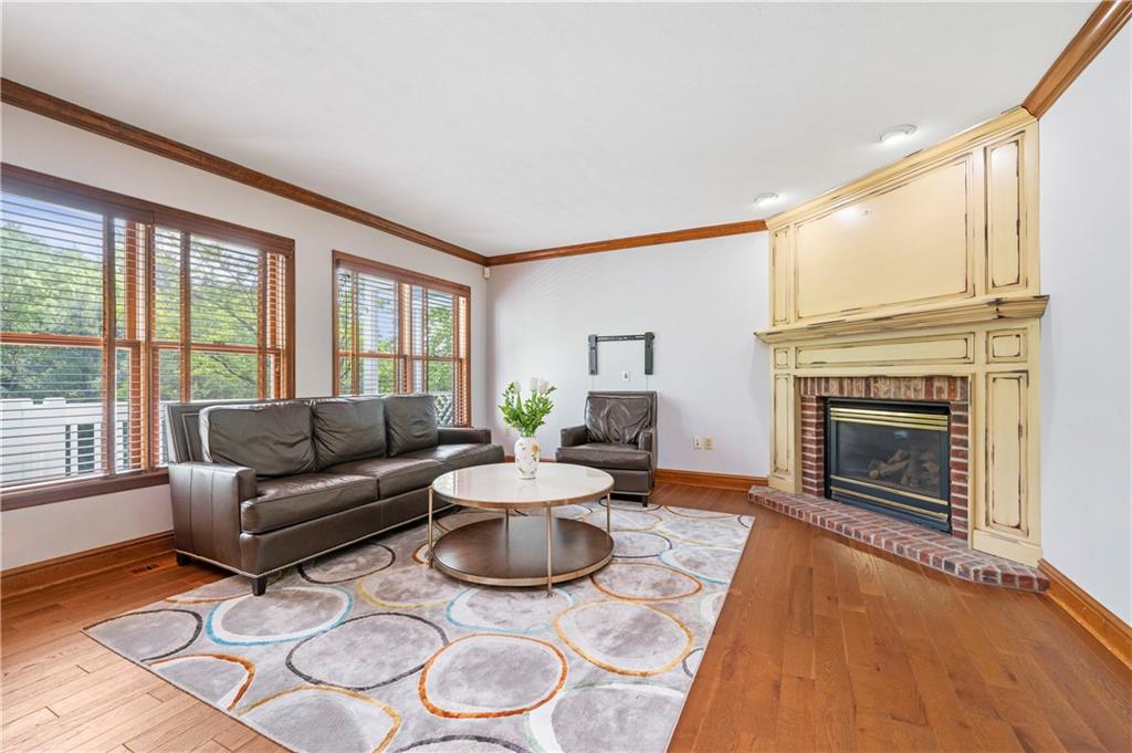 103 Golfview Drive Gibsonia, PA 15044 - Photo 15 of 33 a living room with furniture a fireplace and a large window