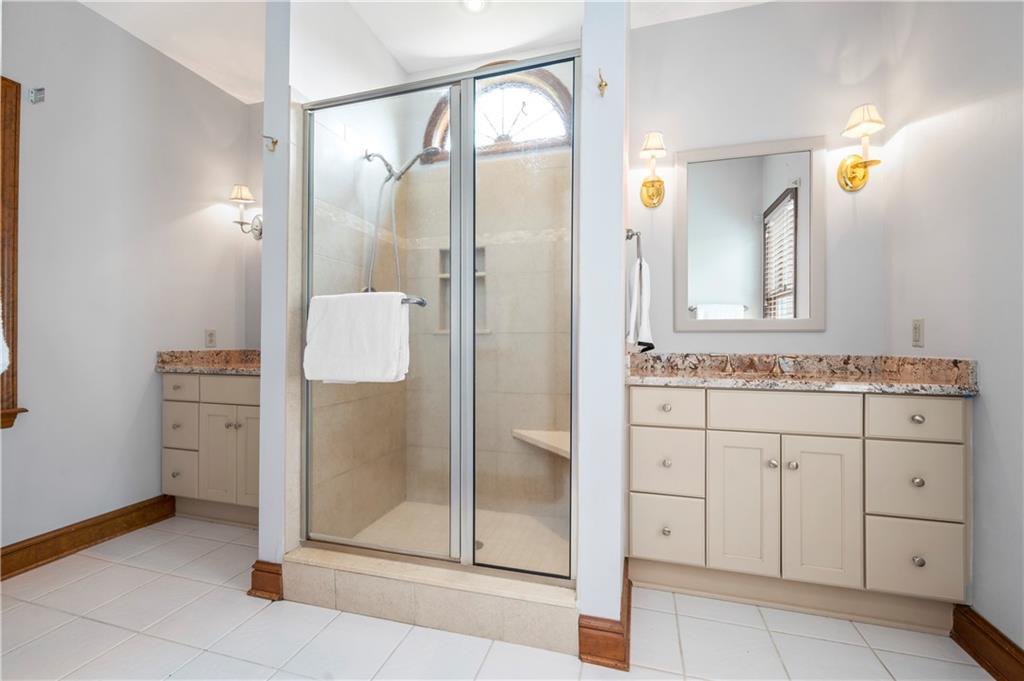 103 Golfview Drive Gibsonia, PA 15044 - Photo 18 of 33 a bathroom with a granite countertop sink mirror and shower