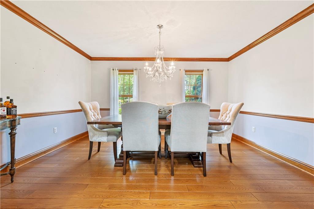 103 Golfview Drive Gibsonia, PA 15044 - Photo 7 of 33 a view of a dining room with furniture window and wooden floor