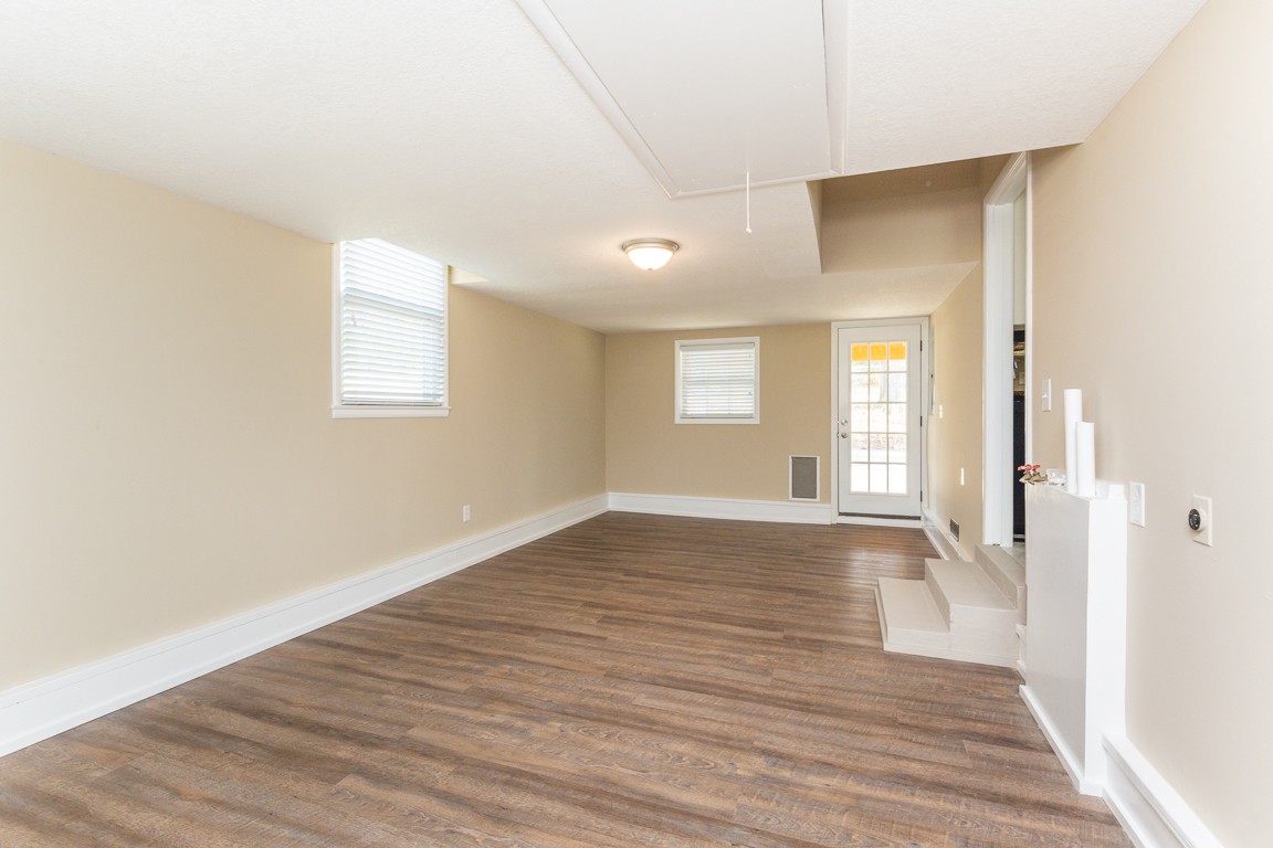 20 Binks Drive Clarksville, TN 37042 - Photo 17 of 35 a view of an empty room with wooden floor and a window