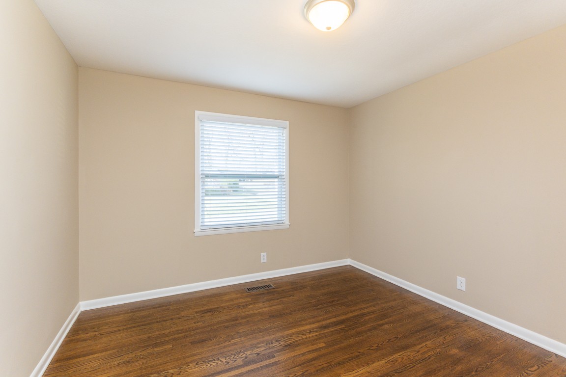 20 Binks Drive Clarksville, TN 37042 - Photo 18 of 35 an empty room with wooden floor and windows