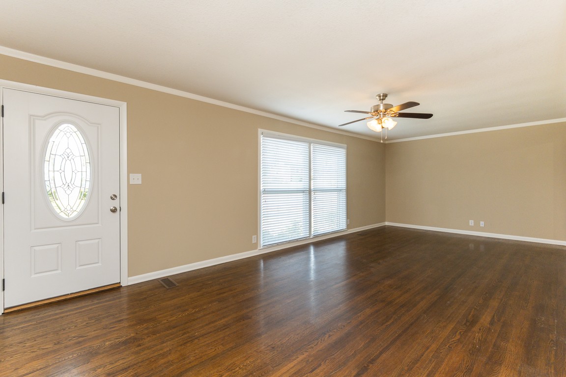 20 Binks Drive Clarksville, TN 37042 - Photo 3 of 35 an empty room with wooden floor fan and windows