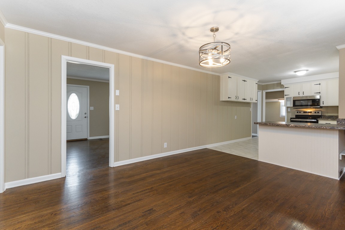 20 Binks Drive Clarksville, TN 37042 - Photo 8 of 35 a view of a kitchen with wooden floor and a ceiling fan