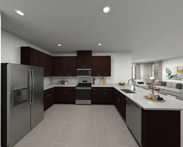 a large kitchen with a center island and stainless steel appliances