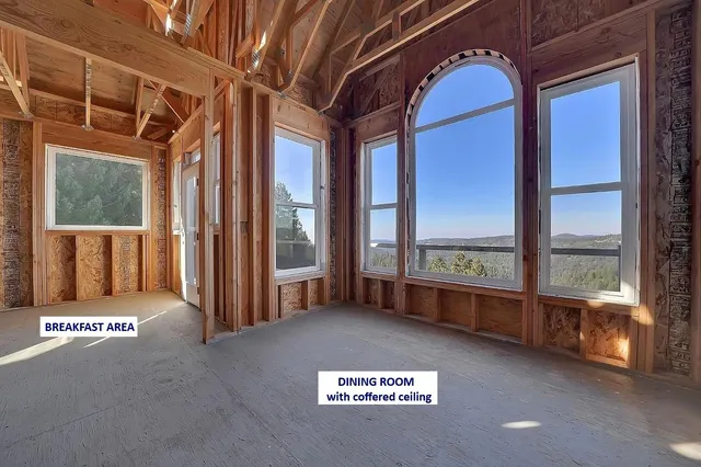 a view of a city with lush green forest