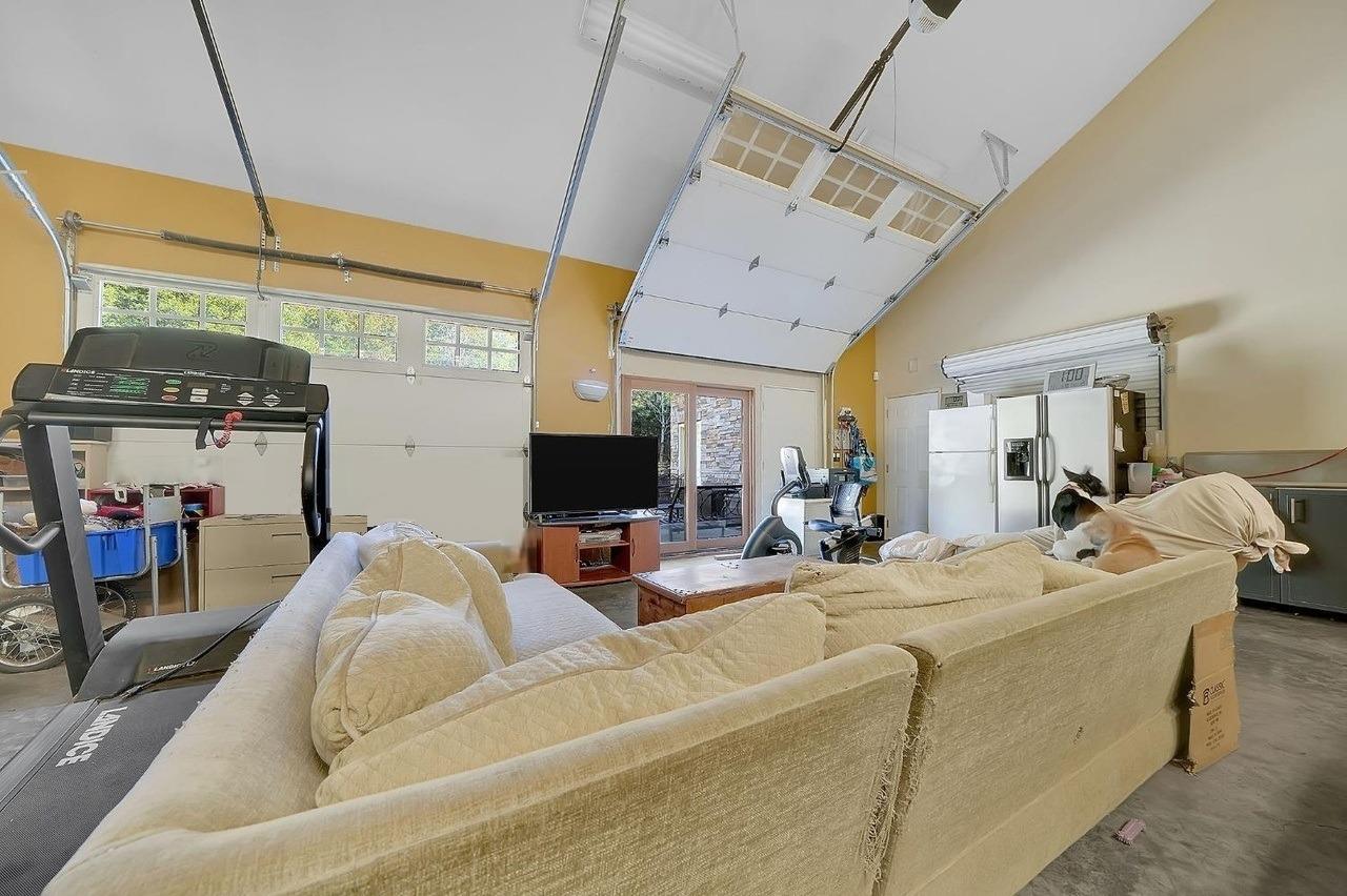 24985 Shake Ridge Road Volcano, CA 95689 - Photo 89 of 92 a view of a livingroom with furniture and a flat screen tv