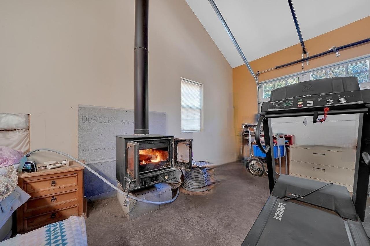 24985 Shake Ridge Road Volcano, CA 95689 - Photo 90 of 92 a living room with furniture and a flat screen tv