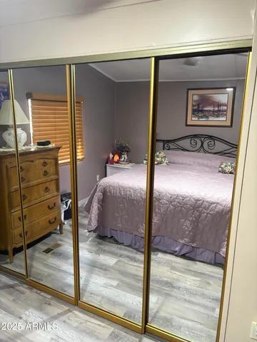 a bedroom with a bed and window