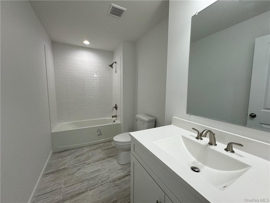 16 Pinto Road Middletown, NY 10941 - Photo 25 of 36 Full bathroom with vanity, toilet, tile patterned floors, and tiled shower / bath