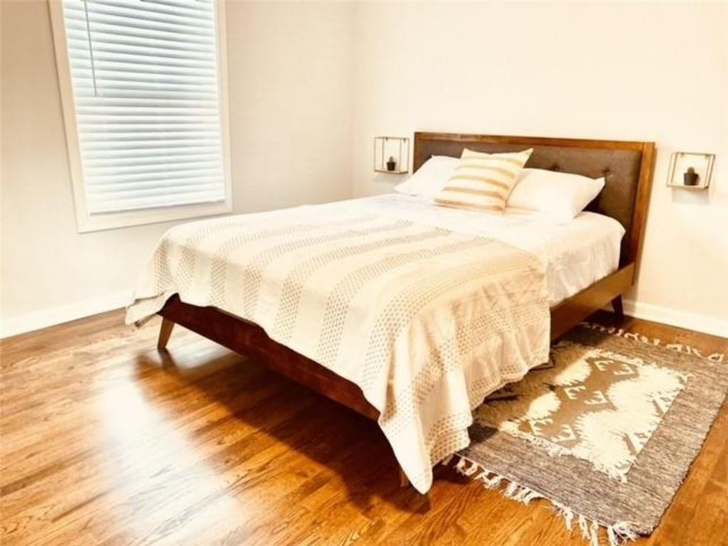 85 Meldon Avenue Southeast Atlanta, GA 30315 - Photo 12 of 23 a bedroom with a bed and a window