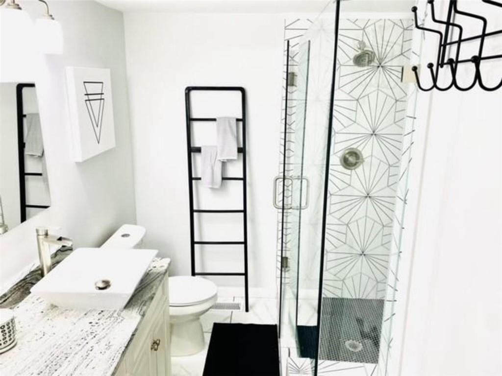 85 Meldon Avenue Southeast Atlanta, GA 30315 - Photo 13 of 23 a bathroom with a granite countertop sink toilet and shower