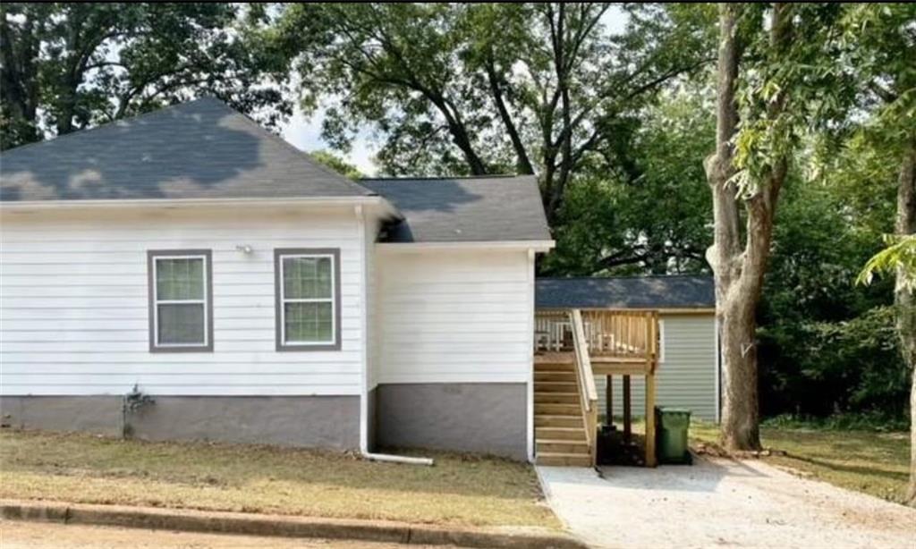 85 Meldon Avenue Southeast Atlanta, GA 30315 - Photo 3 of 23 a front view of a house with a yard