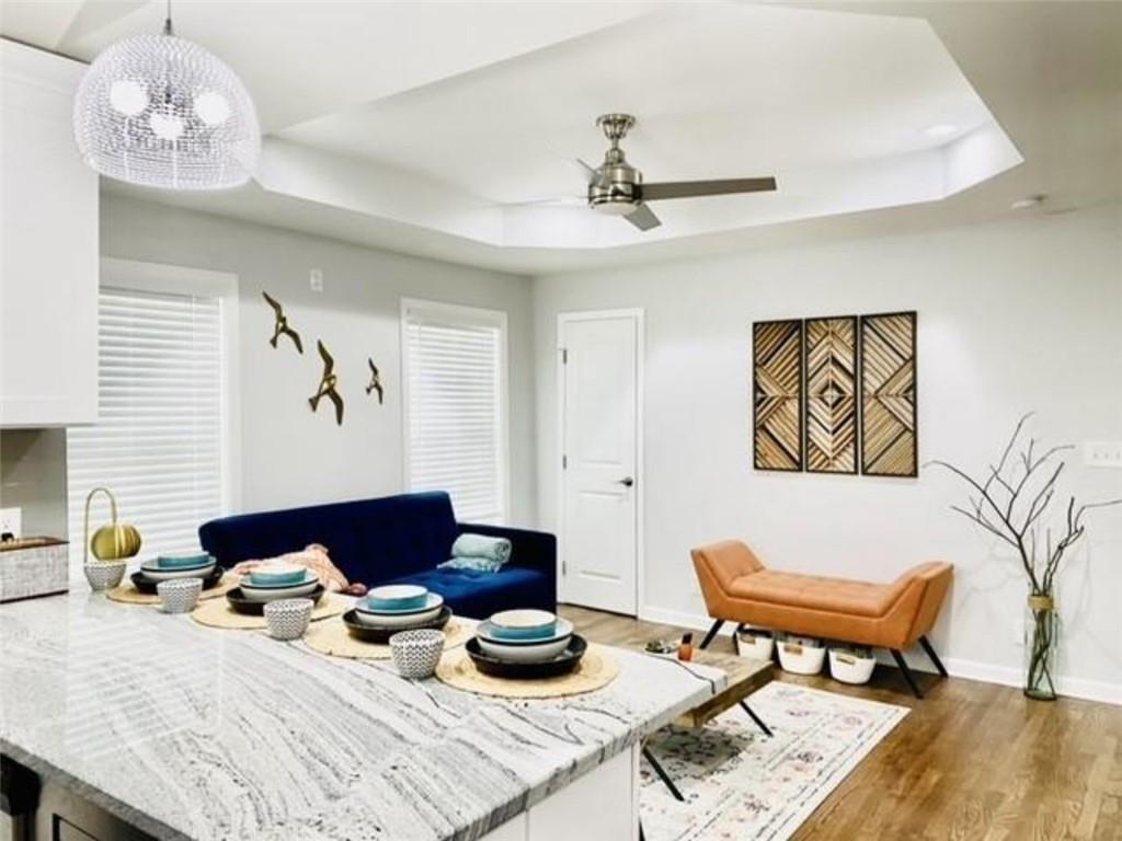 85 Meldon Avenue Southeast Atlanta, GA 30315 - Photo 4 of 23 a bedroom with furniture and a chandelier