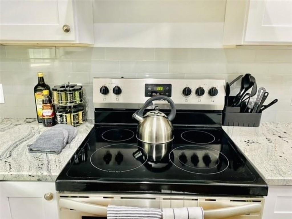 85 Meldon Avenue Southeast Atlanta, GA 30315 - Photo 6 of 23 a stove top oven sitting inside of a kitchen