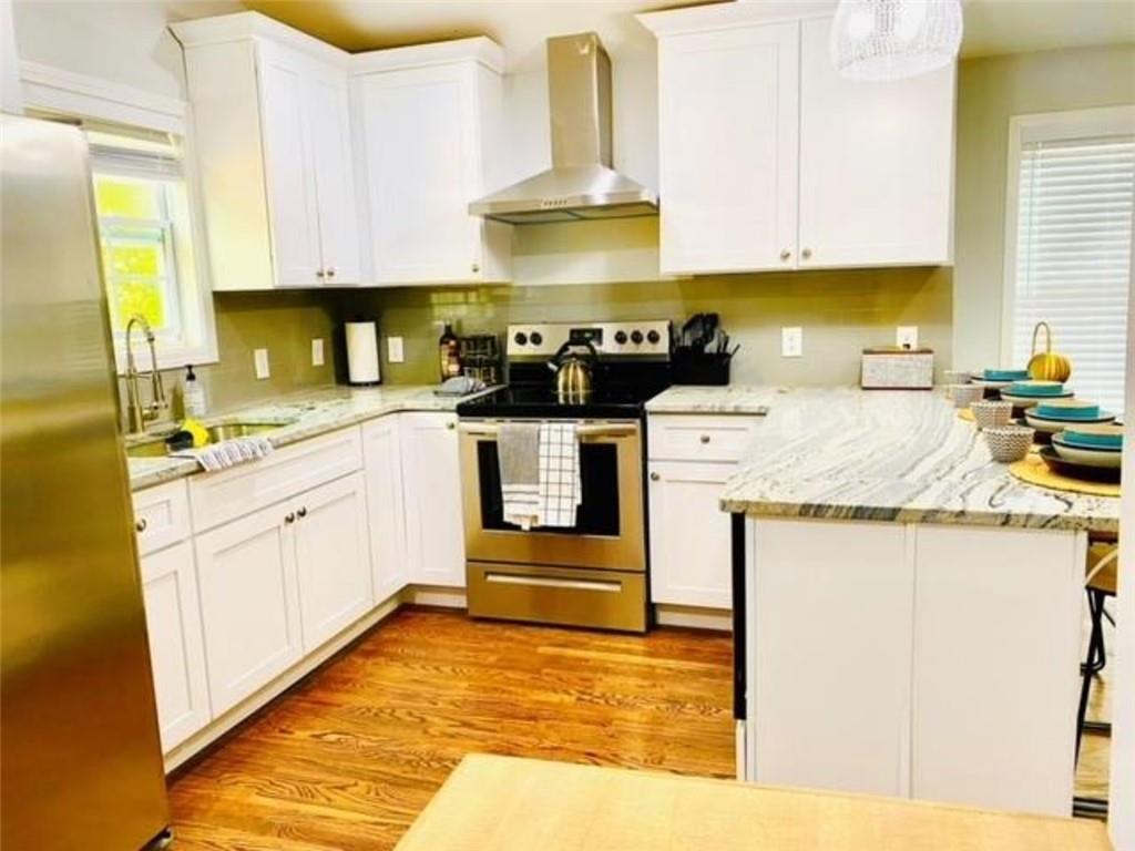85 Meldon Avenue Southeast Atlanta, GA 30315 - Photo 7 of 23 a kitchen with stainless steel appliances granite countertop a stove sink and cabinets