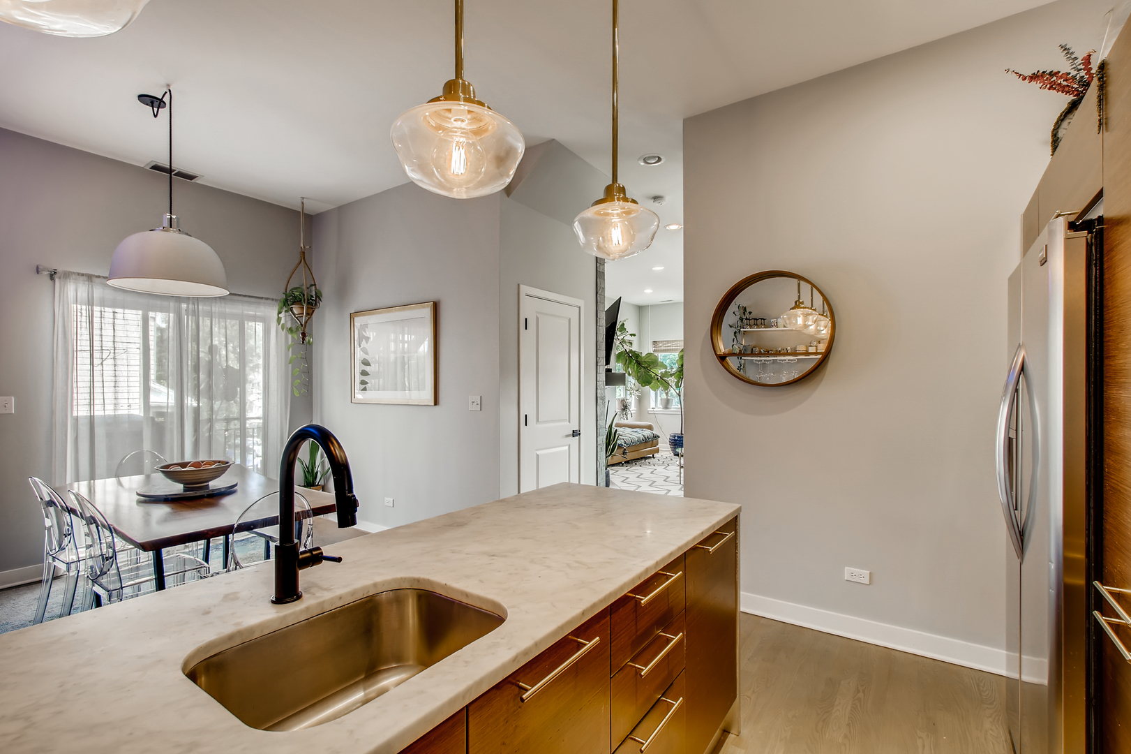 3744 West George Street, Unit D Chicago, IL 60618 - Photo 12 of 30 a kitchen with a table and a chandelier
