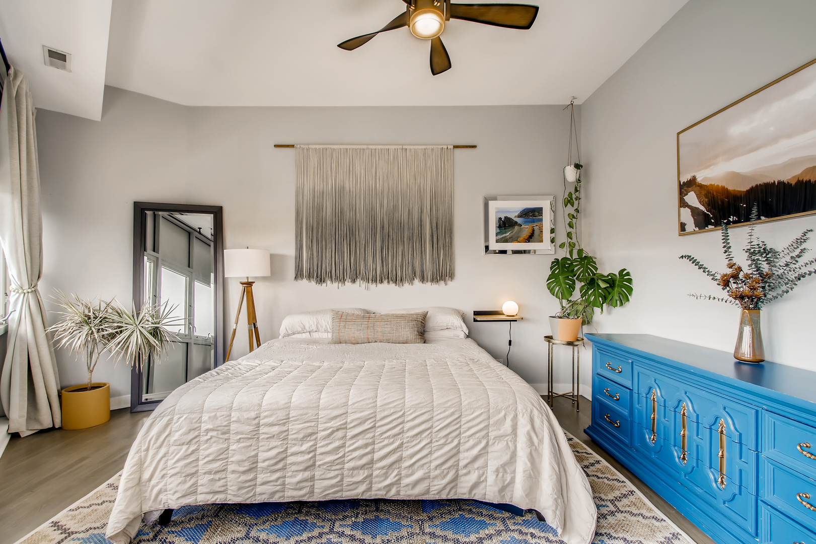 3744 West George Street, Unit D Chicago, IL 60618 - Photo 16 of 30 a bedroom with a large bed and a chandelier