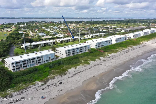 a view of a city with an ocean beach