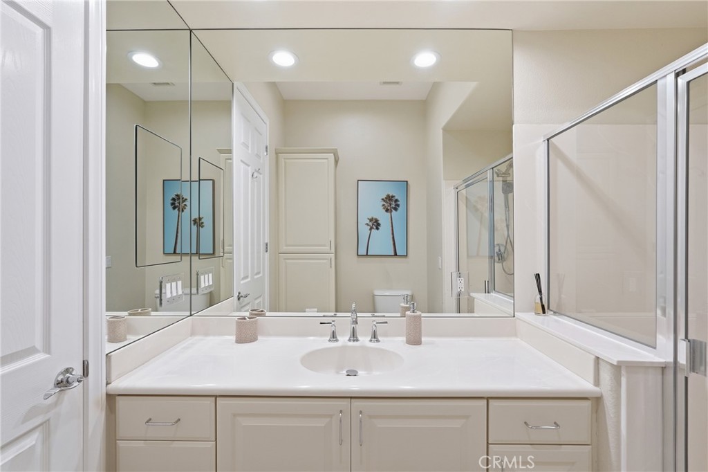 9 Orleans Road Rancho Mirage, CA 92270 - Photo 43 of 71 a bathroom with a sink and a mirror