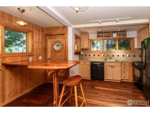 a kitchen with stainless steel appliances a sink stove and microwave