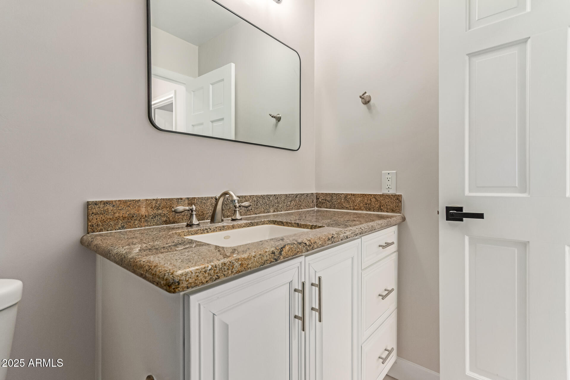 3301 East Rovey Avenue Paradise Valley, AZ 85253 - Photo 31 of 105 a bathroom with a granite countertop sink and a mirror