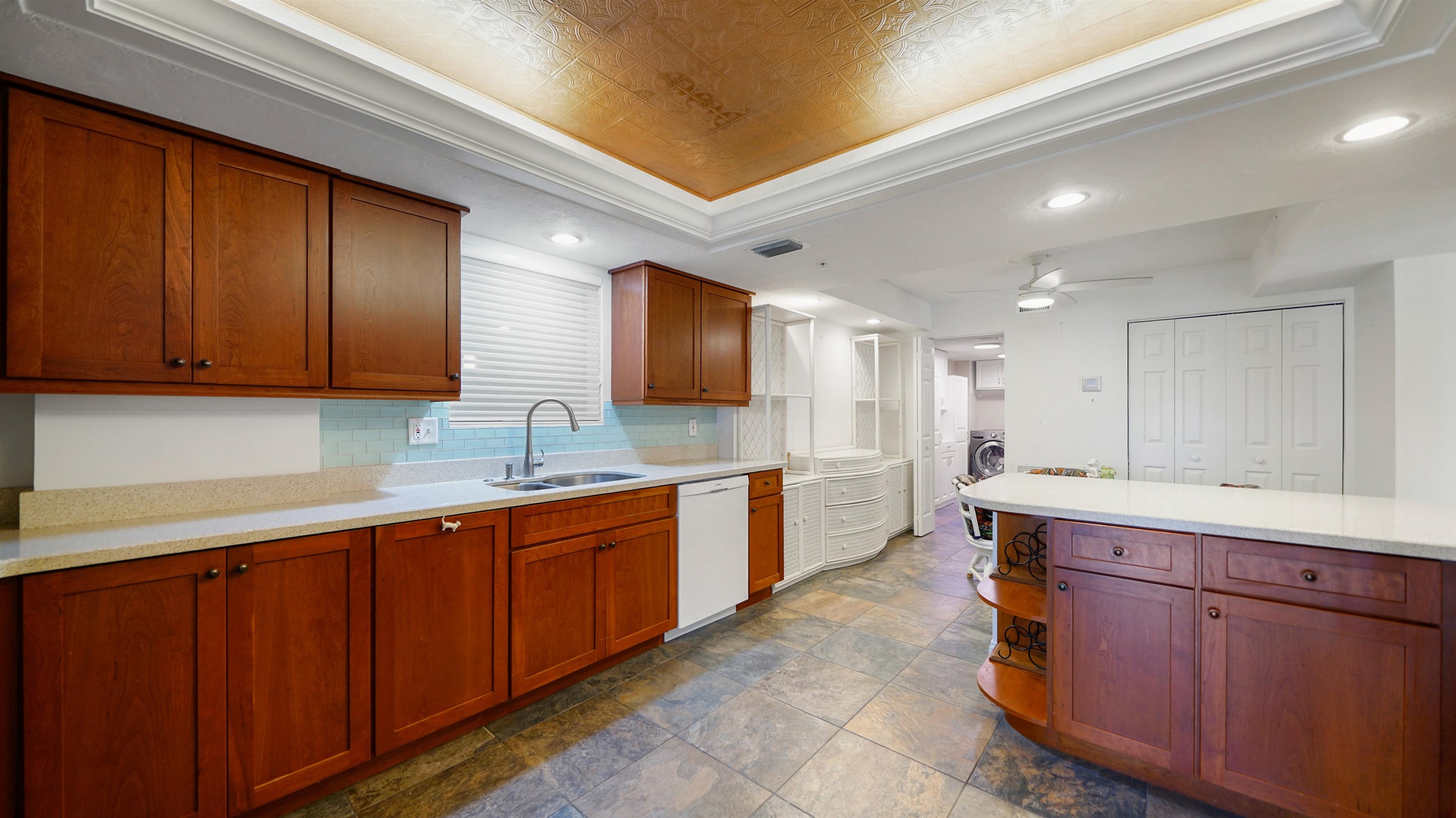 1 John Anderson Drive, Unit 218 Ormond Beach, FL 32176 - Photo 13 of 69 a large kitchen with stainless steel appliances wooden cabinets and a sink
